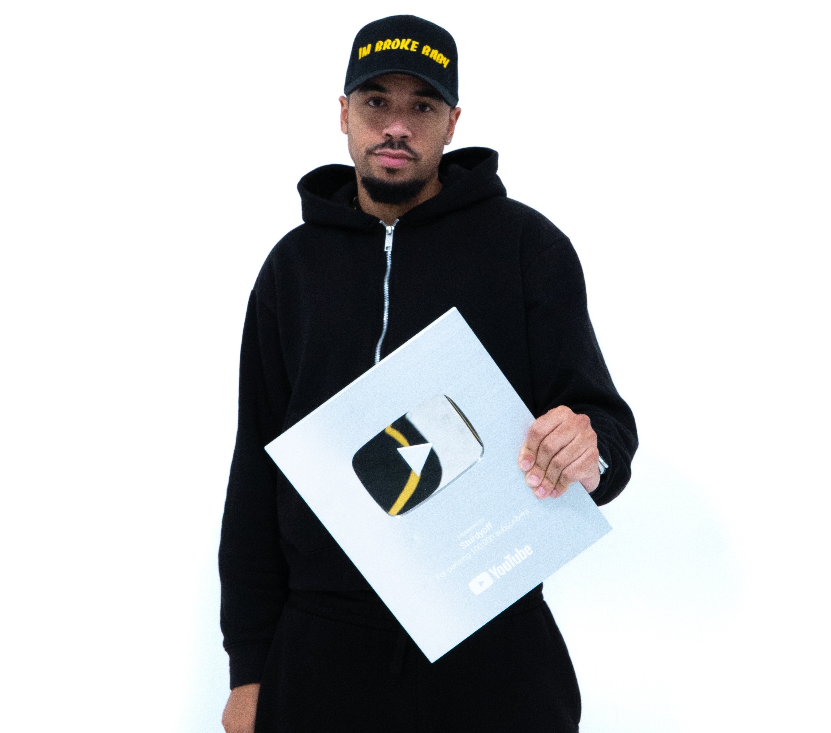 Jordan Green holding the Sturdy Off YouTube Creator Award